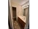 Bathroom with a single sink vanity, and a view to a tub at 2012 Ashley Rd, Charlotte, NC 28208