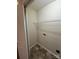 Small laundry room with connections and wire shelving at 2012 Ashley Rd, Charlotte, NC 28208