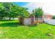 Charming backyard with a white-railed screened porch and well-maintained lawn, ideal for relaxation at 2079 Audubon Dr, Rock Hill, SC 29732