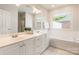 Bright bathroom with double vanity, soaking tub, and tile flooring for a luxurious feel at 2079 Audubon Dr, Rock Hill, SC 29732