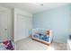 bedroom with a white framed bed, and light blue wall paint at 2079 Audubon Dr, Rock Hill, SC 29732