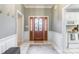 The entryway showcases a decorative glass front door and tiled flooring, offering a glimpse into the home's interior at 2079 Audubon Dr, Rock Hill, SC 29732