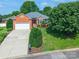 Aerial view of a red brick home that features an attached garage and a well-maintained lawn and landscaping at 2079 Audubon Dr, Rock Hill, SC 29732