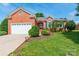 Charming brick home boasts a well-manicured lawn, attached garage, and inviting front entrance at 2079 Audubon Dr, Rock Hill, SC 29732