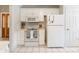 Efficient kitchen with white appliances, tile floors, and ample storage in a bright space at 2079 Audubon Dr, Rock Hill, SC 29732