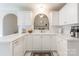 Well-lit kitchen with white cabinetry, spacious countertops, and view to a cozy living space at 2079 Audubon Dr, Rock Hill, SC 29732