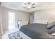 Comfortable bedroom featuring tray ceiling, fan, and access to a modern, bright bathroom at 2079 Audubon Dr, Rock Hill, SC 29732