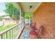 Relaxing covered porch with brick columns and comfortable seating at 2079 Audubon Dr, Rock Hill, SC 29732
