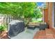 Outdoor patio with a grill, an outdoor sofa, and a glass table at 2079 Audubon Dr, Rock Hill, SC 29732