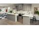 Eat-in kitchen featuring white countertops, gray cabinets, stainless appliances, and open layout at 2158 N Graham St # 14, Charlotte, NC 28206