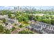 Stunning aerial view showcases a vibrant neighborhood with lush greenery and a picturesque city skyline at 223 S Bruns Ave, Charlotte, NC 28208