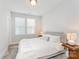 Well-lit bedroom with a comfortable bed, side tables, and a large window for natural light at 223 S Bruns Ave, Charlotte, NC 28208