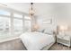 Bright bedroom with a tufted headboard, side tables, and plenty of natural light at 223 S Bruns Ave, Charlotte, NC 28208