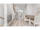Open-concept dining area flowing into a modern kitchen with clean lines and natural light at 223 S Bruns Ave, Charlotte, NC 28208