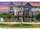 Charming townhome with a modern design, brick accents, and well-manicured landscaping at 223 S Bruns Ave, Charlotte, NC 28208