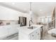 Modern kitchen featuring white cabinets, stainless steel appliances, and a center island with a sink at 223 S Bruns Ave, Charlotte, NC 28208