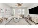 Bright living room featuring a large sectional couch, area rug, and natural light at 223 S Bruns Ave, Charlotte, NC 28208