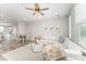 Open-concept living room with comfortable seating, stylish decor, and an adjacent dining area at 223 S Bruns Ave, Charlotte, NC 28208