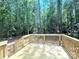 New wood deck in a private, wooded backyard, perfect for outdoor enjoyment at 2330 Neill Rd, Lancaster, SC 29720
