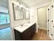 Bathroom with double sinks and dark wood cabinets at 2330 Neill Rd, Lancaster, SC 29720