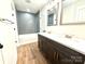 Modern bathroom boasts a double vanity and stylish gray tiled shower and tub at 2330 Neill Rd, Lancaster, SC 29720