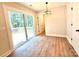 Bright bedroom featuring sliding doors to a deck and a view of the trees at 2330 Neill Rd, Lancaster, SC 29720