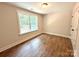 Bright bedroom with wood-look floors and a large window at 2330 Neill Rd, Lancaster, SC 29720