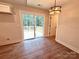 Bright dining area with a modern light fixture and sliding door to a deck at 2330 Neill Rd, Lancaster, SC 29720