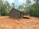 Exterior of the home showcasing the deck and wooded lot at 2330 Neill Rd, Lancaster, SC 29720