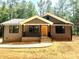 Inviting single-story house featuring a cozy front porch and neutral exterior at 2330 Neill Rd, Lancaster, SC 29720
