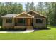 Charming single-story home with a welcoming porch and manicured lawn at 2330 Neill Rd, Lancaster, SC 29720