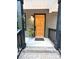 Inviting front door with brick stairs, dark railing, stylish rug, and decorative potted plant for curb appeal at 2330 Neill Rd, Lancaster, SC 29720