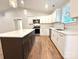 Well-lit kitchen featuring white cabinets, an island, and stainless steel appliances at 2330 Neill Rd, Lancaster, SC 29720