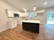 Bright, modern kitchen with white cabinets, center island, and stainless steel appliances at 2330 Neill Rd, Lancaster, SC 29720