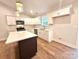 Modern kitchen with white cabinets, stainless steel appliances, and a spacious island at 2330 Neill Rd, Lancaster, SC 29720