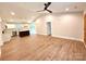 Spacious open-concept living room showcases wood-look floors that flow into the kitchen with a view to the deck at 2330 Neill Rd, Lancaster, SC 29720
