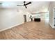 Spacious open-concept living room showcases wood-look floors that flow into the kitchen with a view to the deck at 2330 Neill Rd, Lancaster, SC 29720