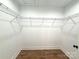 Spacious walk-in closet featuring wood floors and metal racking system for ample storage at 2330 Neill Rd, Lancaster, SC 29720