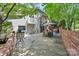 Spacious backyard featuring a patio, seating, shade, and mature trees at 24756 Strand Dr, Albemarle, NC 28001