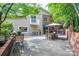 Spacious backyard patio with dining area and lush landscaping at 24756 Strand Dr, Albemarle, NC 28001