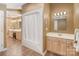 Bright bathroom with bathtub/shower combination and double sinks at 24756 Strand Dr, Albemarle, NC 28001