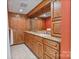 Bathroom featuring ample storage, dual sinks, granite counters, and tiled floors at 24756 Strand Dr, Albemarle, NC 28001