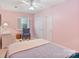 Cozy bedroom with large windows, ceiling fan, and plenty of natural light at 24756 Strand Dr, Albemarle, NC 28001