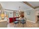 Cozy dining area featuring a glass-top table, seating for four, and an open floor plan at 24756 Strand Dr, Albemarle, NC 28001