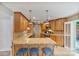 Kitchen with granite counter seating and stainless steel appliances at 24756 Strand Dr, Albemarle, NC 28001