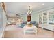 Bright living room featuring neutral colors, recessed lighting, and a decorative chandelier at 24756 Strand Dr, Albemarle, NC 28001