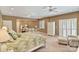 Spacious main bedroom with sitting area, ceiling fan and light neutral decor at 24756 Strand Dr, Albemarle, NC 28001