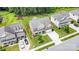 Aerial view of a two-story home showcasing the landscaping, driveway, and surrounding neighborhood at 2577 Shoal Park Rd, Concord, NC 28027