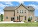Home's back exterior with a patio and outdoor seating area that's ideal for entertaining and relaxation at 2577 Shoal Park Rd, Concord, NC 28027