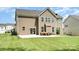 Exterior of a house showing a large backyard with patio, great for outdoor enjoyment at 2577 Shoal Park Rd, Concord, NC 28027